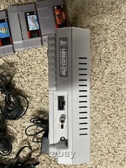 Super Nintendo SNES System Console With 2 OEM Controllers, Cables and 4 Games