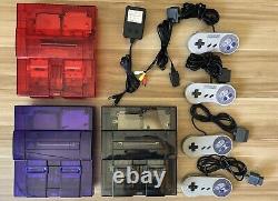 Super Nintendo SNES System Console in clear red, black, and purple