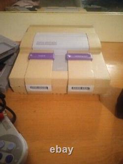 Super Nintendo system SNES Console With 4 games one controller
