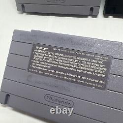 Câbles d'origine de la Super Nintendo Entertainment System (SNES), 11 jeux et 3 manettes.