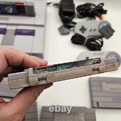Console Super Nintendo SNES & Bundle de jeux Super Mario (World, All Stars & Kart)