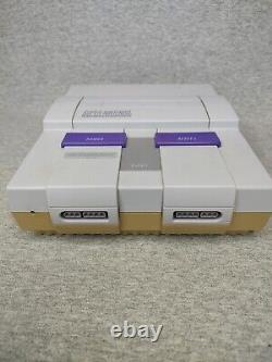 Console Super Nintendo SNES avec bundle de 2 manettes et 4 jeux testés.