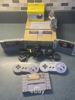 Console Super Nintendo SNES avec manette, câbles et jeux