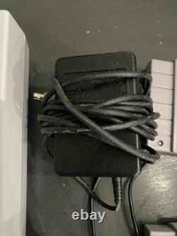 Console Super Nintendo SNES avec manettes et jeux