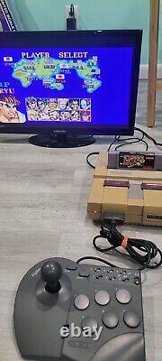 Console Super Nintendo (SNES) avec un lot de 14 excellents jeux : Mario Kart, NBA Jam.