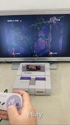 Console Super Nintendo SNES en EXCELLENT état avec manettes et jeux.