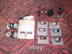 Console Super Nintendo SNES originale testée avec lot de 3 manettes et 6 jeux.