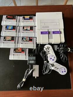 Console Super Nintendo avec jeux et manuels