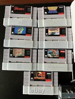 Console Super Nintendo avec jeux et manuels