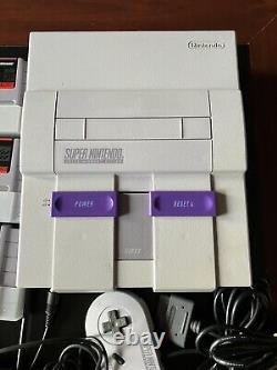 Console Super Nintendo avec jeux et manuels