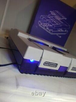 Console de jeu Super Nintendo SNES transparente, claire et violette SNS-001 avec lumières