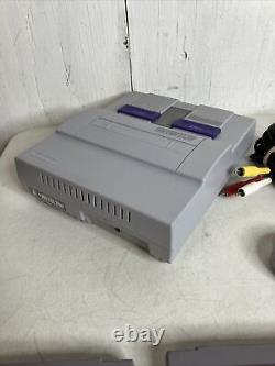 Console de système Super Nintendo SNES avec 4 jeux Mario Kart et 1 manette.