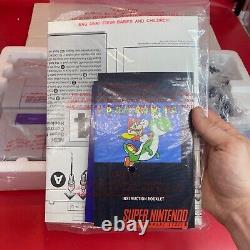 Ensemble Nintendo Super Set SNES complet dans sa boîte avec plateau, couvercle, pochettes, inserts et attaches.