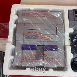 Ensemble Nintendo Super Set SNES complet dans sa boîte avec plateau, couvercle, pochettes, inserts et attaches.