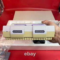 Ensemble Nintendo Super Set SNES complet dans sa boîte avec plateau, couvercle, pochettes, inserts et attaches.