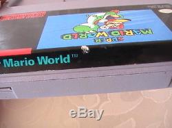 La Console Du Système Super Nintendo Snes Dans La Boîte Avec Super Mario World Works