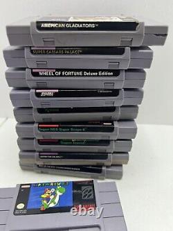 Lot de bundle Super Nintendo SNES comprenant 10 jeux, manettes et câbles.