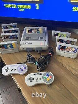 Super Nintendo SNES ÉNORME bundle console 2 manettes 8 jeux Mario Street Fighter DK CL3