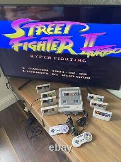 Super Nintendo SNES ÉNORME bundle console 2 manettes 8 jeux Mario Street Fighter DK CL3