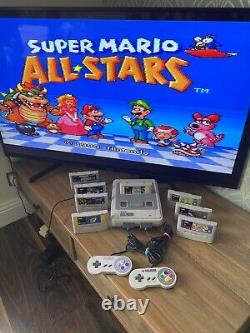 Super Nintendo SNES ÉNORME bundle console 2 manettes 8 jeux Mario Street Fighter DK CL3