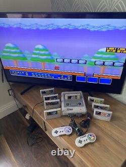 Super Nintendo SNES ÉNORME bundle console 2 manettes 8 jeux Mario Street Fighter DK CL3