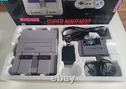 Système Super Nintendo complet dans la boîte SNES avec console Mario testée et fonctionnelle